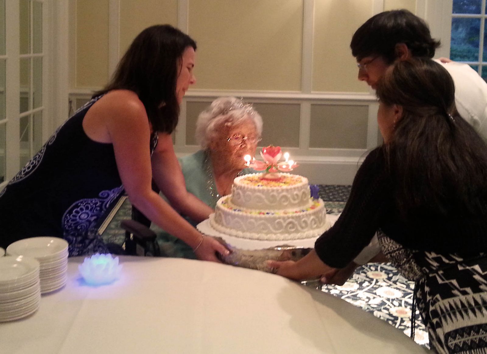 Gertrude blows out the candles on her birthday cake.